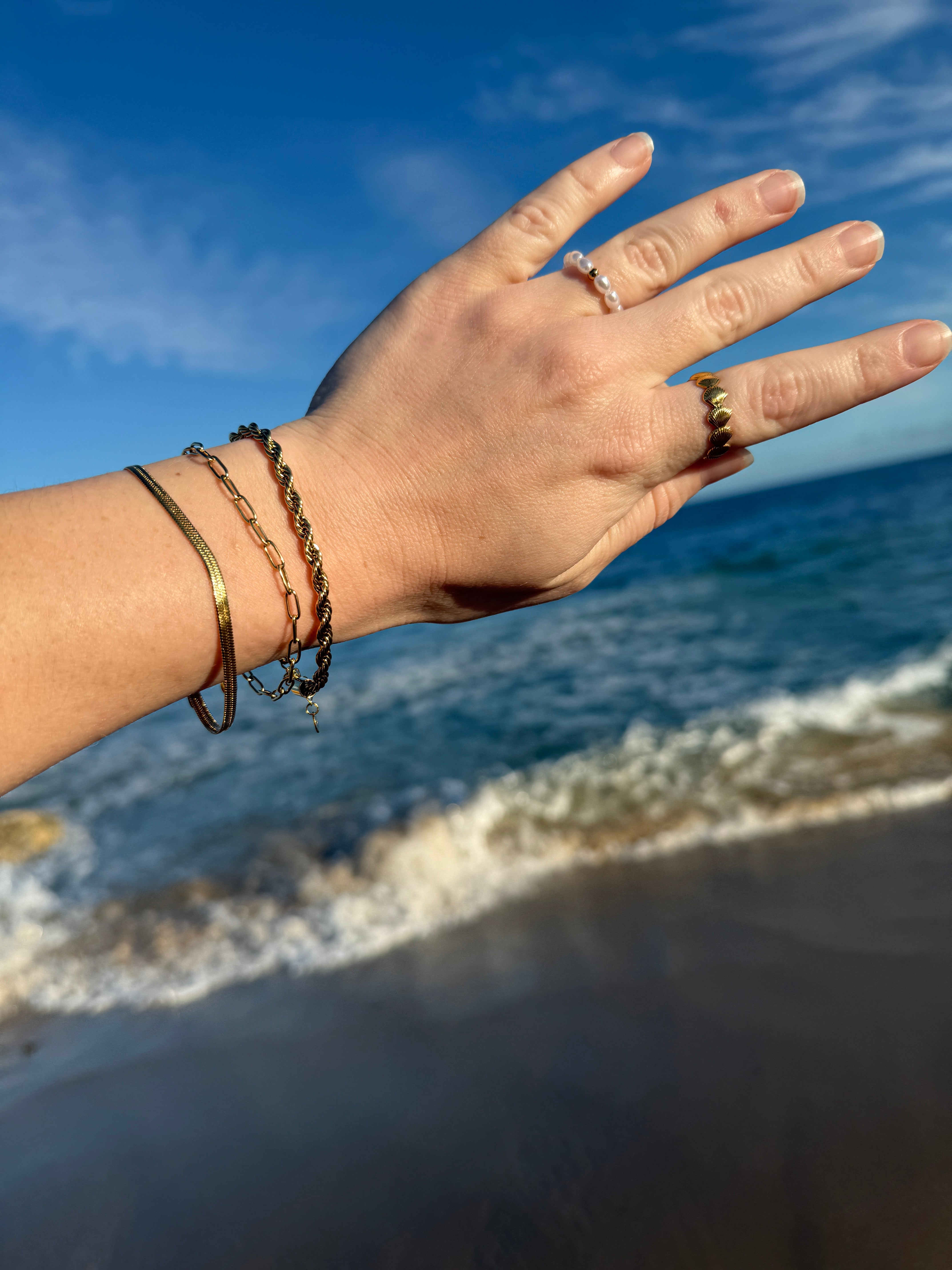 waterproof 18k gold chain bracelets worn at the beach 